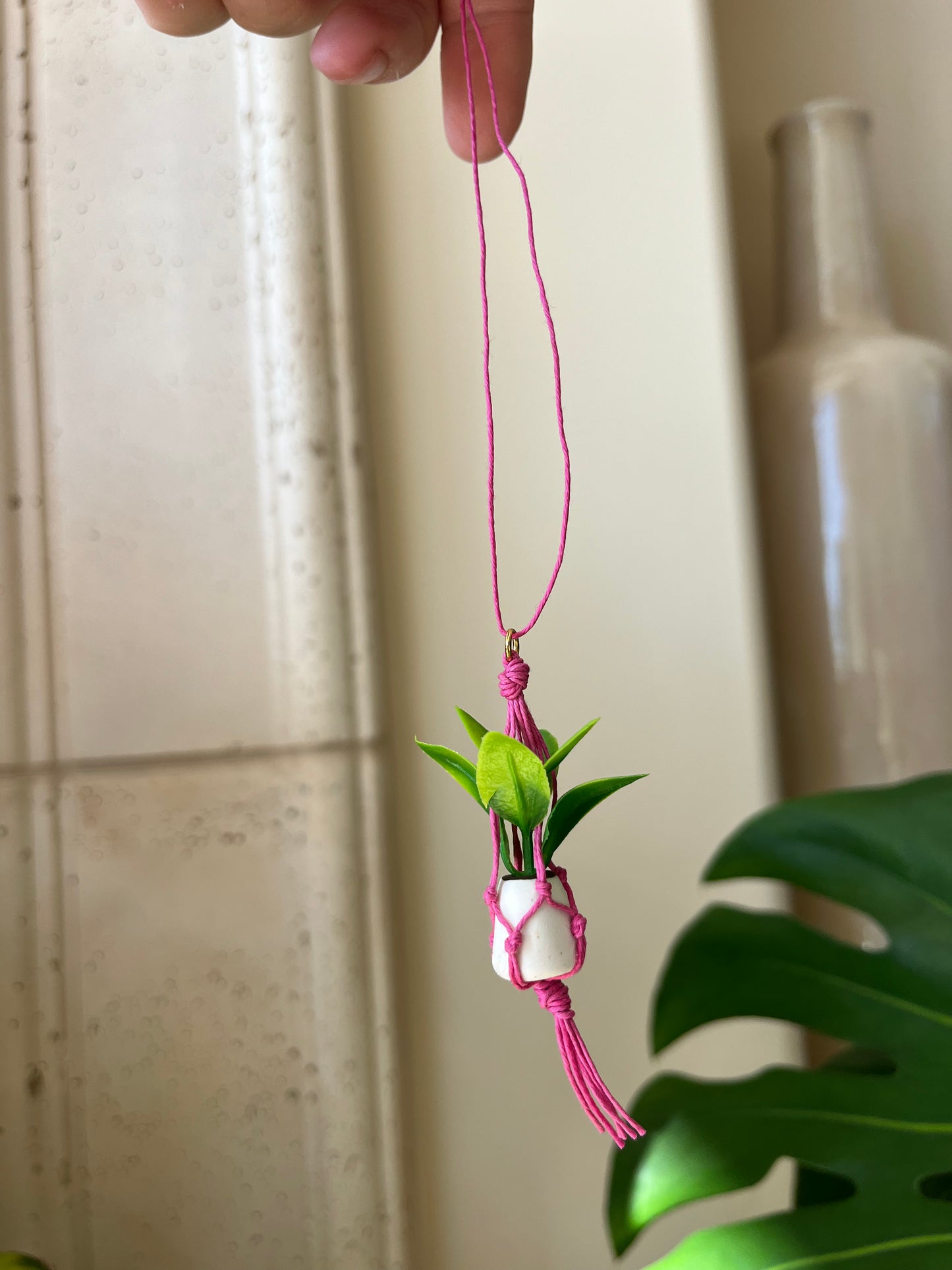 pink string - white pot