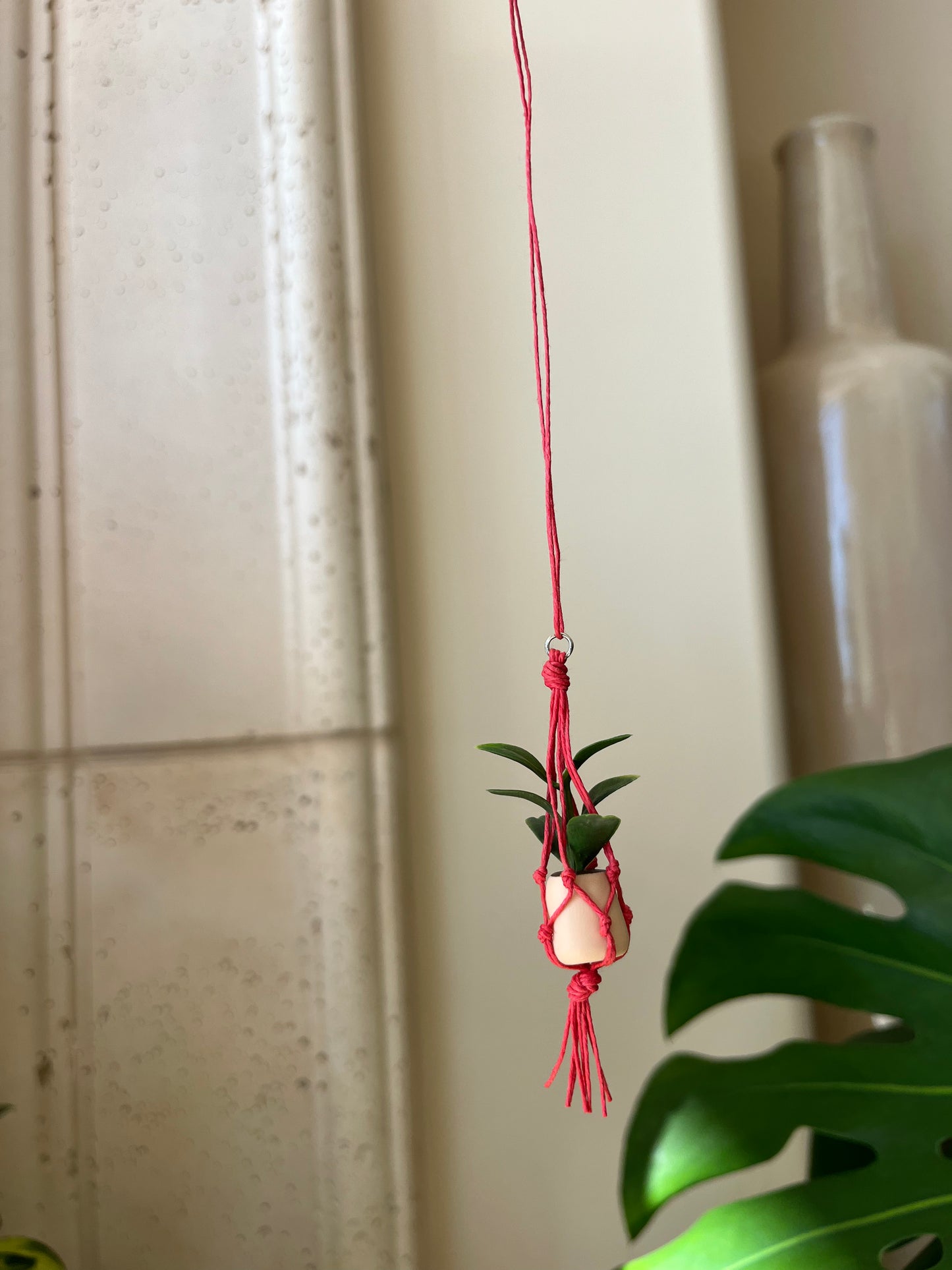 red string - cream pot