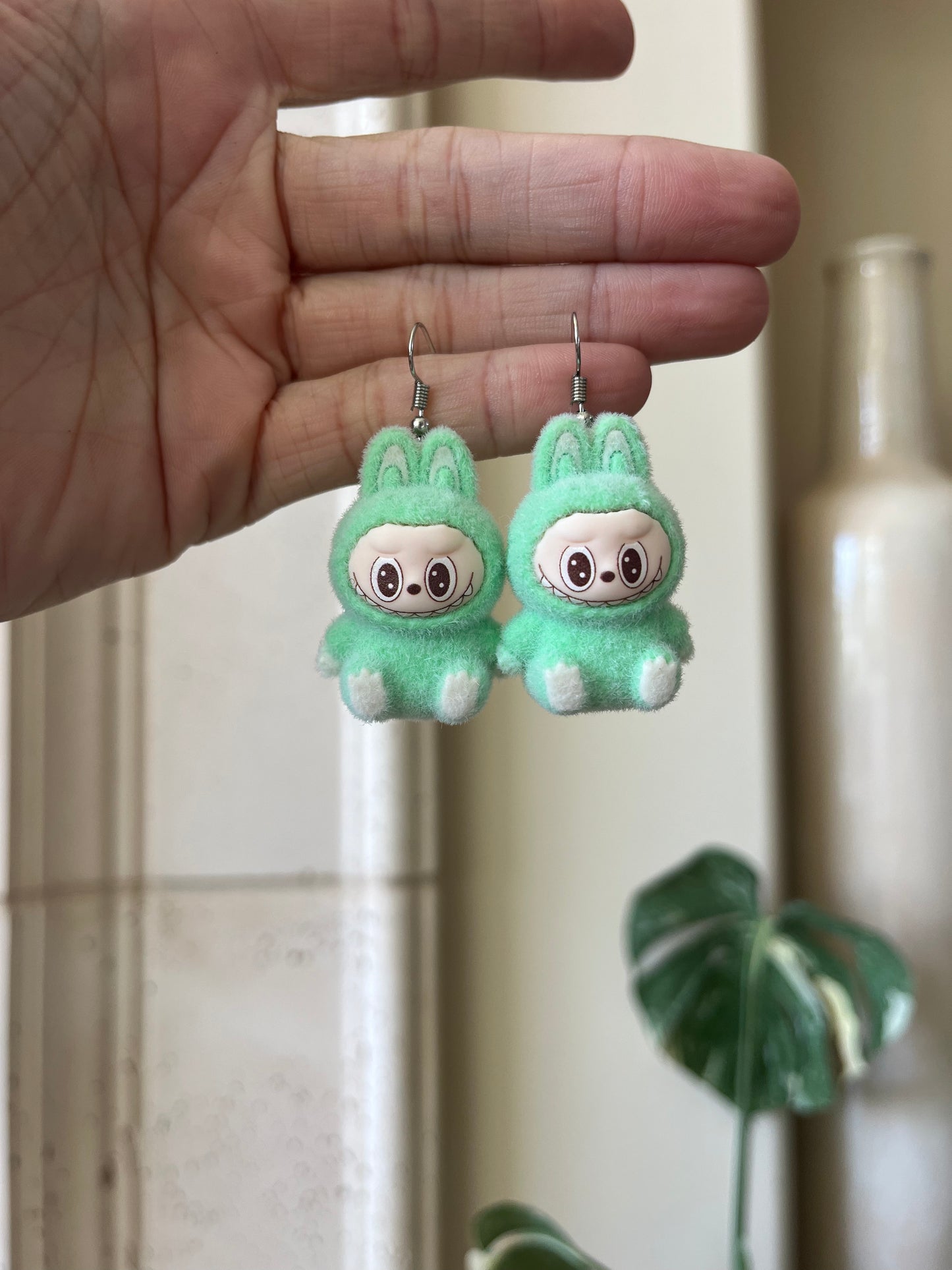 green sitting - silver metal