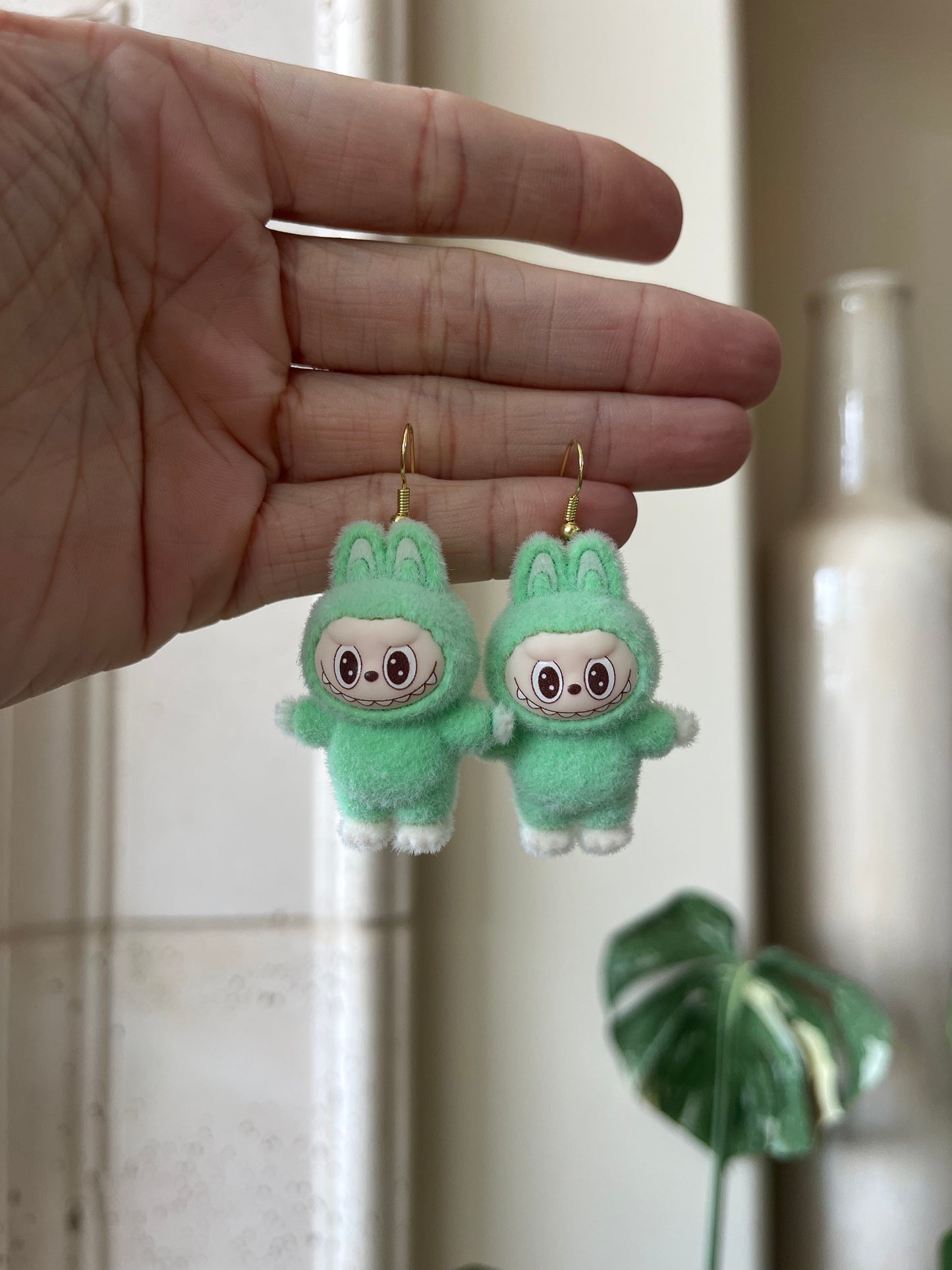 green standing - gold metal