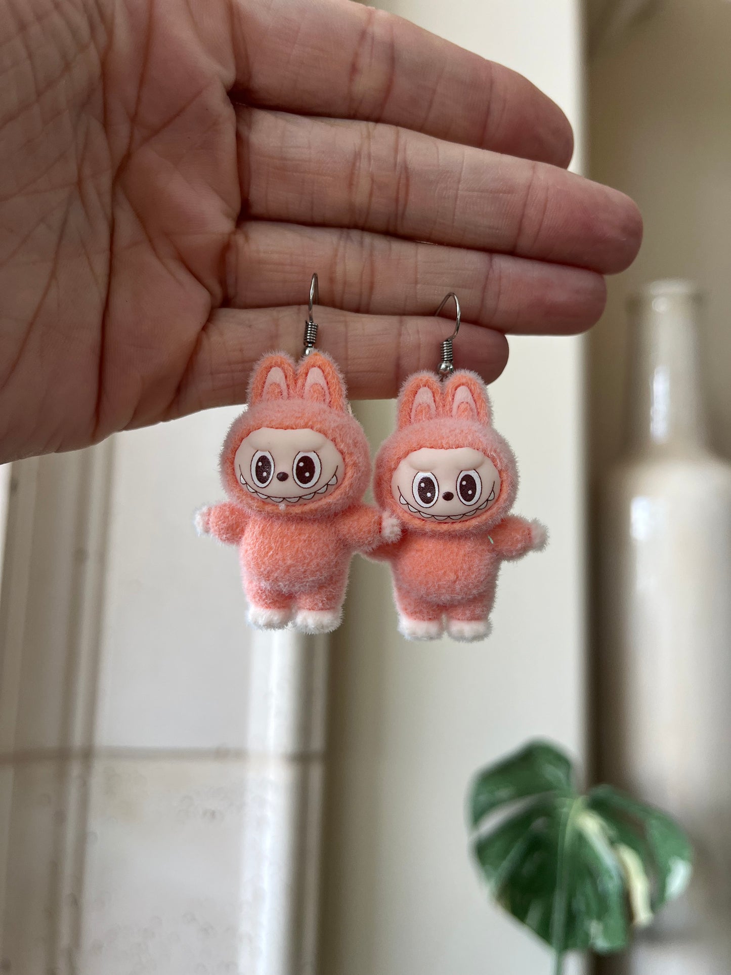 orange standing - silver metal