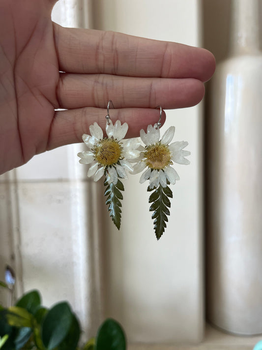 white flower and fern